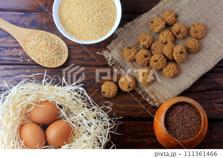 homemade gluten free and lactose free cookies on rustic wooden table with ingredients 111361466