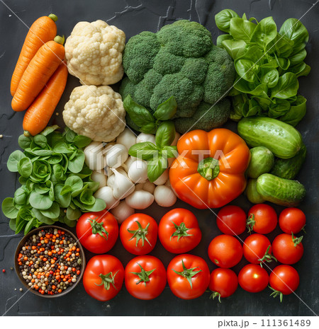 Variety of fresh vegetables on dark background, top view 111361489