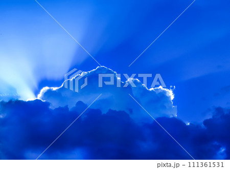 bright rays of the sun emerging from clouds at sunset time bright rays of the sun emerging from clouds at sunset time 111361531