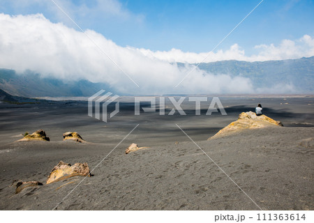 The scenery view of Whispering Sand on the volcanic complex in ancient caldera in Bromo Tengger Semeru national park, East Java, Indonesia. The scenery view of Whispering Sand on the volcanic complex in ancient caldera in Bromo Tengger Semeru national park, East Java, Indonesia. 111363614