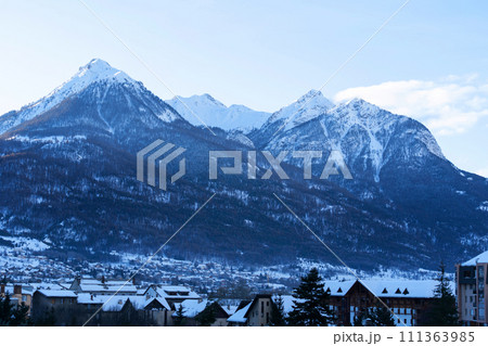 Cityscape of Brianson, ski resort in France. Mountain covered with snow and fog. Alpine landscape 111363985