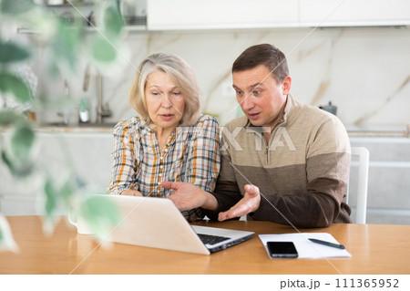 Old woman considering offer from agent Old woman considering offer from agent 111365952
