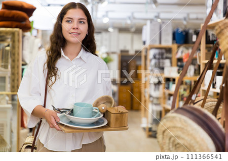 Woman shopping at store of household goods 111366541