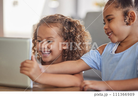 Tablet game for happy kids, children or friends having fun, bond and play youth online games at home. Family, happiness and young girl or sisters smile while playing fun digital video game together 111366989