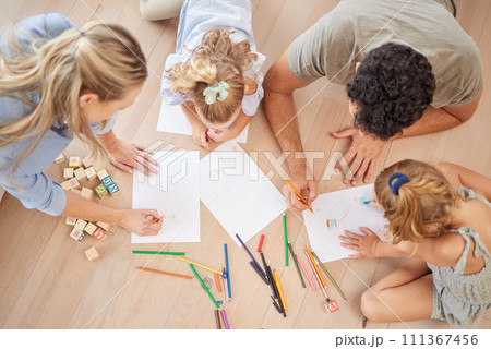 Family with creative children drawing on paper, home school and fun educational activity, learning and project. Above of parents, kids doodle, color and play for healthy growth, development and art Family with creative children drawing on paper, home school and fun educational activity, learning and project. Above of parents, kids doodle, color and play for healthy growth, development and art 111367456