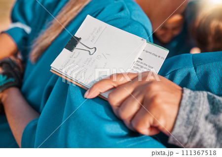 Notebook goals, sports coach hand and girl team in baseball or softball training with group of people hug together for strategy or motivation. Coaching teamwork notes list on women athlete progress Notebook goals, sports coach hand and girl team in baseball or softball training with group of people hug together for strategy or motivation. Coaching teamwork notes list on women athlete progress 111367518