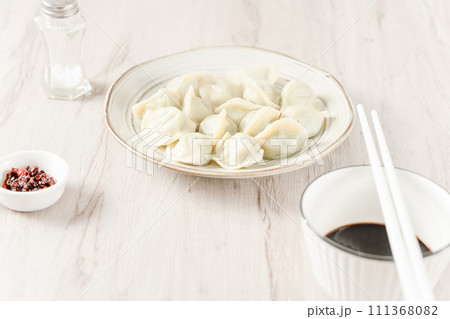 dumplings with red sauce 111368082