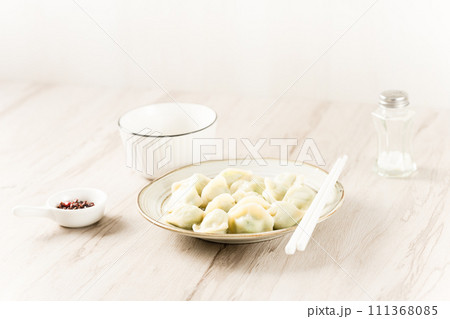 dumplings with red sauce 111368085