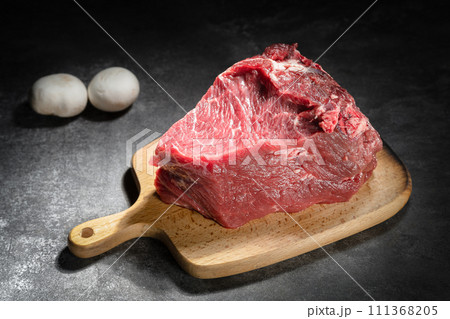 raw beef steak on a black background 111368205