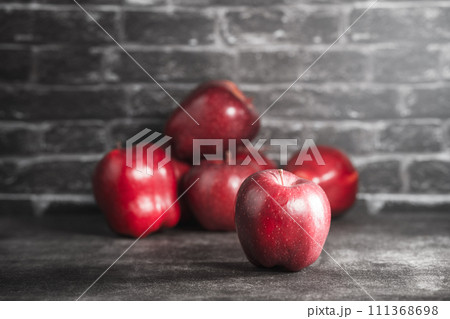 red apples on wooden background 111368698