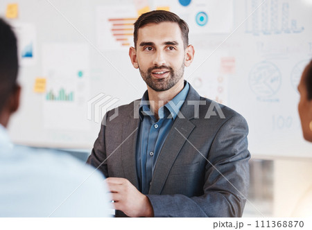Business man, marketing and accounting speaker in a team office meeting. Company worker presenter explain financial data and finance graph to a company strategy and work planning employee group Business man, marketing and accounting speaker in a team office meeting. Company worker presenter explain financial data and finance graph to a company strategy and work planning employee group 111368870