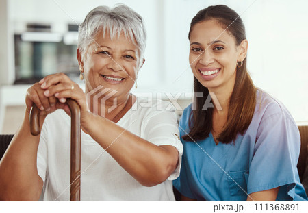 Healthcare, doctor and elderly woman bonding, sitting on sofa during a checkup at assisted living facility. Senior care, support and nursing with young caretaker discussing option and treatment 111368891