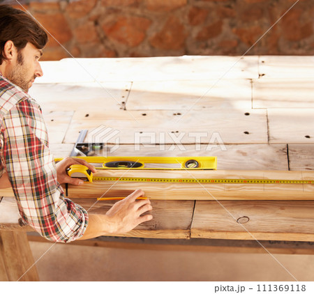 Handyman, marking and measuring tape on wood in workshop, home repairs and professional with plan. Person, working and handcraft with maintenance, job and career in industry, skill and technique Handyman, marking and measuring tape on wood in workshop, home repairs and professional with plan. Person, working and handcraft with maintenance, job and career in industry, skill and technique 111369118