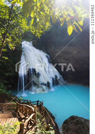 Ko Luang Waterfall is a limestone waterfall in northern Thailand..Calcium carbonate and magnesium occur naturally in Koh luang Fall. The waters get their blue color from the magnesium. 111369462