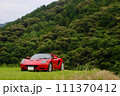 山の中の赤いスポーツカー 111370412