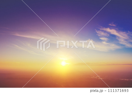 Colorful cloudy sky at sunset. Sky texture abstract nature background. Aerial view of the countryside in the foggy evening Colorful cloudy sky at sunset. Sky texture abstract nature background. Aerial view of the countryside in the foggy evening 111371693