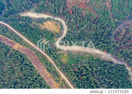 Aerial view of the mountains in autumn. The road along the winding river. Beautiful nature landscape. Prut River, Carpathian mountains. Ukraine 111373280
