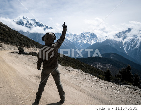 Hiker feel free on high altitude mountain top Hiker feel free on high altitude mountain top 111373585