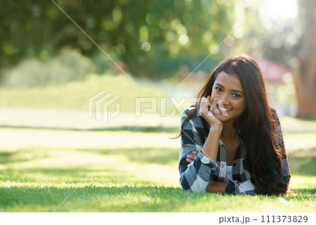 Space, portrait or happy woman on grass to relax for rest in park, nature or field for peace. Mockup, travel or female person on break with smile on outdoor summer vacation or holiday on lawn in USA Space, portrait or happy woman on grass to relax for rest in park, nature or field for peace. Mockup, travel or female person on break with smile on outdoor summer vacation or holiday on lawn in USA 111373829
