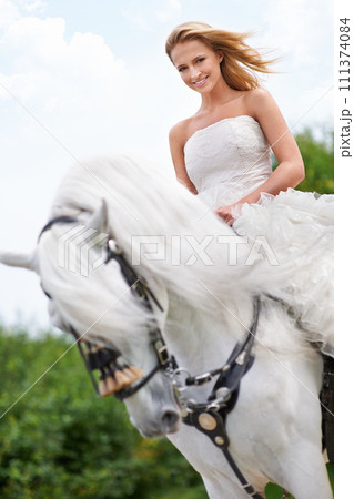 Wedding, woman and portrait with horse outdoor in nature for celebration, marriage or confidence in countryside. Bride, person and stallion in field with smile, dress and animal at ceremony in nature 111374084