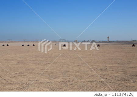 Excursion on ATV in desert 111374526