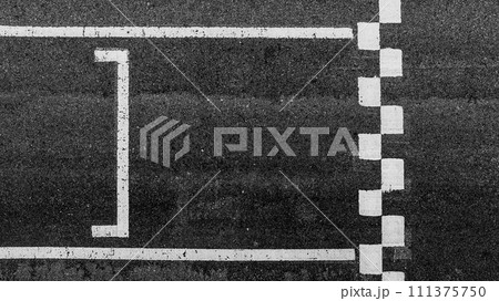 Aerial view abstract asphalt black Start and Finish grid line for race car in circuit texture background, Automobile and automotive background. 111375750