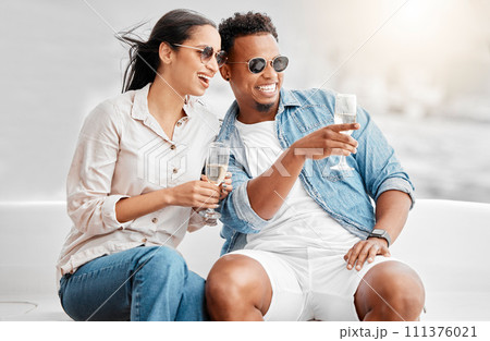 Couple date, champagne celebration and comic conversation at birthday dinner, happy with alcohol and smile for love marriage in the city. Man and woman on terrace with glass of wine in summer Couple date, champagne celebration and comic conversation at birthday dinner, happy with alcohol and smile for love marriage in the city. Man and woman on terrace with glass of wine in summer 111376021