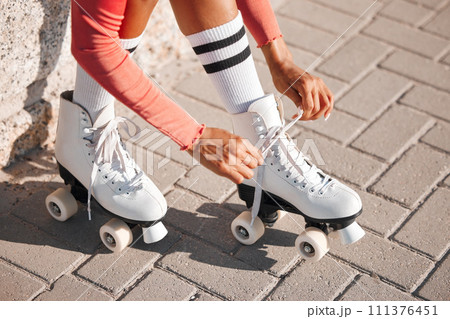 Roller skate shoes, woman tying laces and fun summer fitness activity, holiday workout and urban lifestyle outdoor. Gen z, girl and youth ready to start skating, travel and healthy wellness exercise 111376451