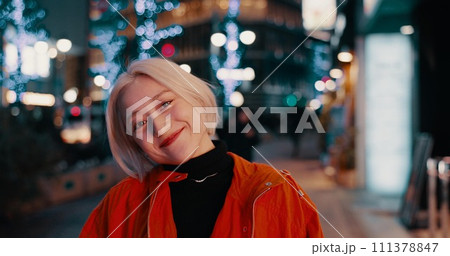 Happy woman, portrait and night in Japanese city of Tokyo with freedom on travel, adventure or journey. Gen z, girl or excited to explore urban town street on vacation or holiday with neon lights 111378847