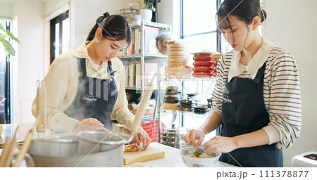 Cooking class, restaurant and women with Japanese food in a kitchen with chef and learning professional skill. Student, education and Asian cuisine course with people together working on skills Cooking class, restaurant and women with Japanese food in a kitchen with chef and learning professional skill. Student, education and Asian cuisine course with people together working on skills 111378877