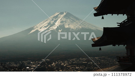 Chureito Pagoda, Mount Fuji and city in morning with temple, trees and blue sky on travel. Japanese architecture, culture and spiritual history with view of mountain, snow and calm Asian landscape. 111378972
