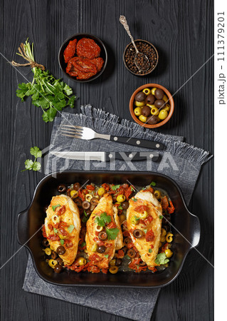 chicken breasts with vegetables, olives, top view 111379201