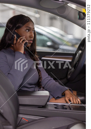 Businesswoman on the Phone in Car 111379252