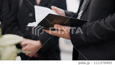 Bible, funeral and hands reading of a priest for religion, sad and mourning event in church. Faith, male person and spiritual passage with worship and book for grief with support and condolences Bible, funeral and hands reading of a priest for religion, sad and mourning event in church. Faith, male person and spiritual passage with worship and book for grief with support and condolences 111379405