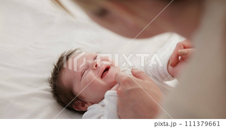 Baby, mother and playing on bed in nursery for bonding, love and support for child development. People, woman and newborn in bedroom of home with fun, hands or happiness for bond, care and smile Baby, mother and playing on bed in nursery for bonding, love and support for child development. People, woman and newborn in bedroom of home with fun, hands or happiness for bond, care and smile 111379661