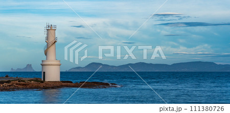 Long Exposure of Ibiza Lighthouse with Es Vedra Island Silhouette Long Exposure of Ibiza Lighthouse with Es Vedra Island Silhouette 111380726