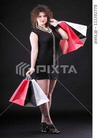 lovely woman with shopping bags 111382778