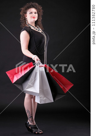 lovely woman with shopping bags 111382780