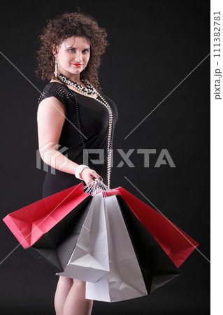 lovely woman with shopping bags 111382781