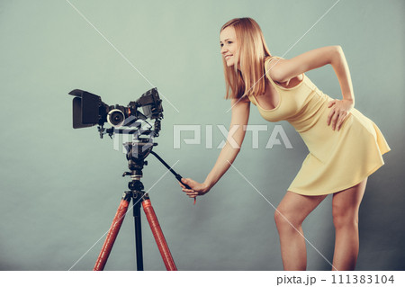 Photographer woman with camera taking photos Photographer woman with camera taking photos 111383104