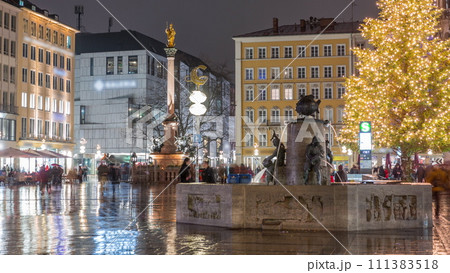Fish Fountain, Fischbrunnen in front of the New New Town Hall at Marienplatz night timelapse in Munich, Germany Fish Fountain, Fischbrunnen in front of the New New Town Hall at Marienplatz night timelapse in Munich, Germany 111383518