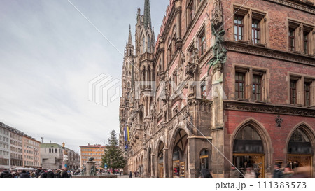 Main facade of the New Town Hall building at the northern part of Marienplatz day to night transition in Munich, Germany. Main facade of the New Town Hall building at the northern part of Marienplatz day to night transition in Munich, Germany. 111383573