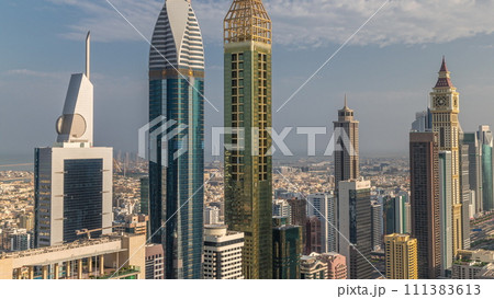 Skyline sunrise view of the high-rise buildings on Sheikh Zayed Road in Dubai aerial timelapse, UAE. Skyline sunrise view of the high-rise buildings on Sheikh Zayed Road in Dubai aerial timelapse, UAE. 111383613