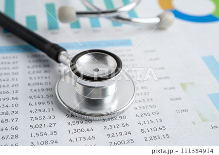 Stethoscope on graph paper, Finance, Account, Statistics, Investment, Analytic research data economy and Business company concept. Stethoscope on graph paper, Finance, Account, Statistics, Investment, Analytic research data economy and Business company concept. 111384914