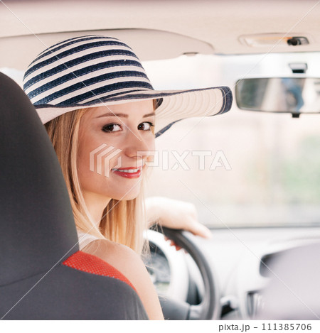 Pretty woman driving her car Pretty woman driving her car 111385706