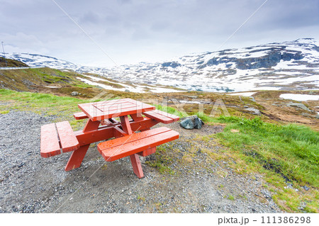 Camp site with picnic table in norwegian mountains Camp site with picnic table in norwegian mountains 111386298