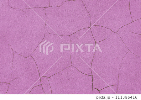Old stucco plaster surface with cracks, pink plaster wall background 111386416