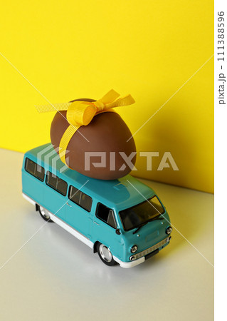 A toy car with a chocolate egg 111388596