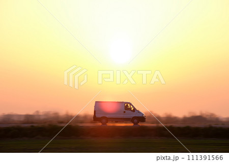 Small cargo van driving on highway hauling goods. Delivery transportation and logistics concept 111391566