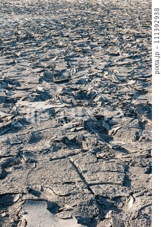Cracked sandy mud ground texture 111392938